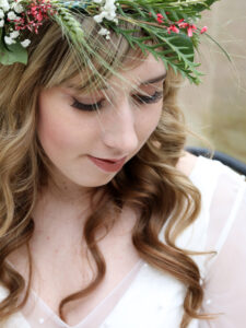 Wedding At Harlaxton Manor. Bride is stood alone taking a moment for herself. 