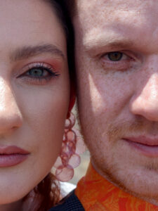 Lanzarote Elopement. A bride and groom have their faces cheek to cheek and are staring directly into the camera.  Destination wedding inspiration